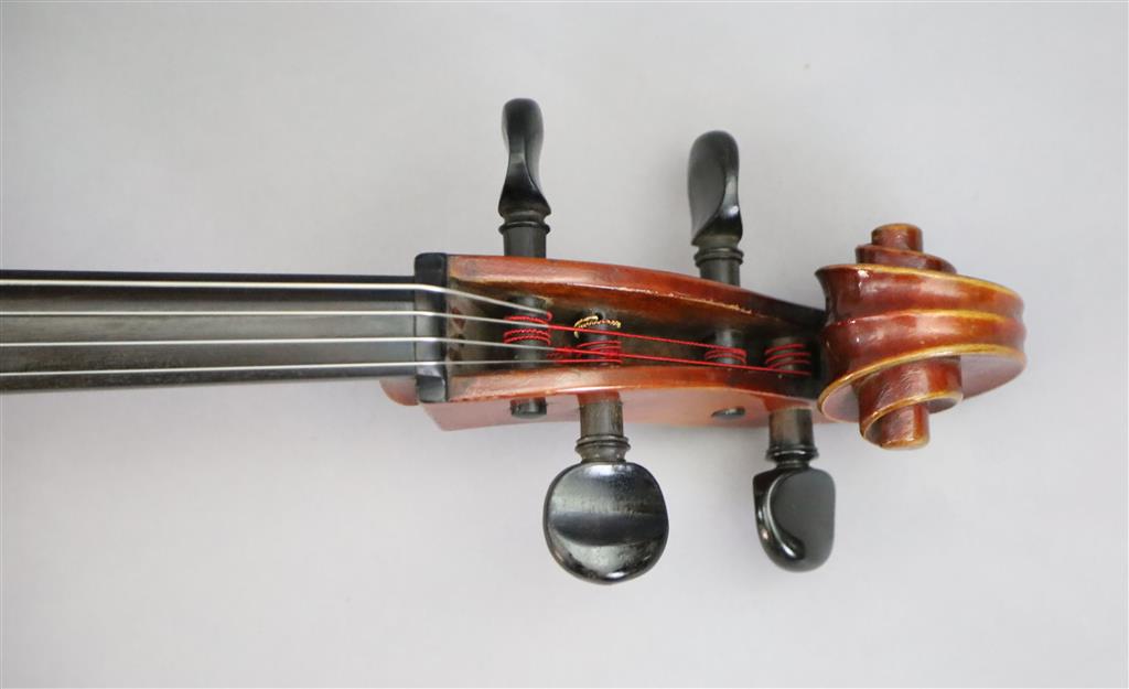 A late 19th/early 20th century German cello, labelled Schutz HD junior Marke, length of back 77cm